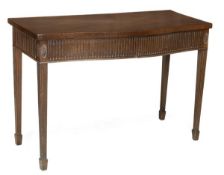 A mahogany serving table in George III style, circa 1900, serpentine fronted, pair of fluted frieze