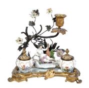 A French porcelain and gilt-metal-mounted inkstand, circa 1900, modelled with a female figure