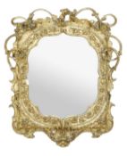 A Victorian gilt composition framed wall mirror, circa 1870, of cartouche form outlined with