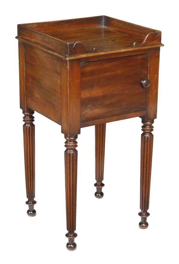 A Regency mahogany bedside cupboard, manner of Gillows, circa 1815, three-quarter scrolling