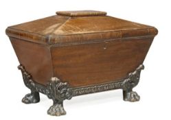 A George IV mahogany wine cooler, circa 1825, possibly Irish, of sarcophagus form, hinged lid,