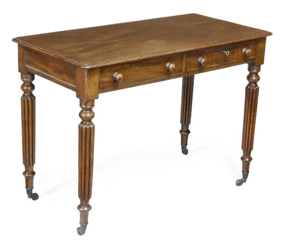 A Regency mahogany library table, circa 1815, in the manner of Gillows, rectangular top with