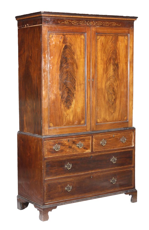 A George III mahogany and marquetry linen press, circa 1800, moulded cornice, pair of flame
