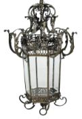 A patinated bronze and bevelled glass hall lantern, 20th century, of hexagonal section, the upper