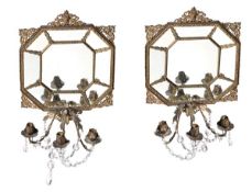 A pair of Continental gilt metal and glass three light girandoles, late 19th century, the leaf clad