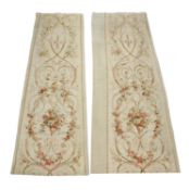 A pair of French Aubusson entre fenetres or window tapestries, circa 1865, decorated with sprigs of