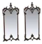 A pair of mahogany wall mirrors, probably Irish, 19th century, shaped rectangular plates, acanthus