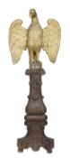 A carved giltwood model of an eagle, 18th century, depicted perched with its wings spread, on a