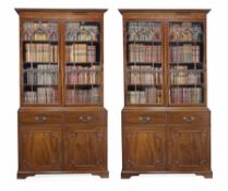A pair of mahogany library bookcases in George III style, circa 1900, each dentil moulded cornice,