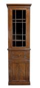 A Regency mahogany cabinet bookcase, circa 1815, in the manner of Gillows, the moulded cornice