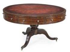 A George III mahogany drum library table, circa 1780, the top with gilt tooled red leather inset,