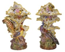 A pair of Nove faience floriform vases, one modelled a peacock, the other a golden pheasant,