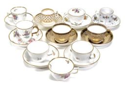 An assortment of Spode ‘Bute’ shape and other porcelain cups and saucers, including a trio, pattern