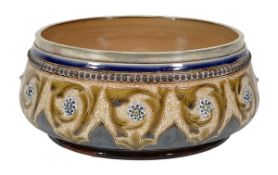 A Doulton Lambeth stoneware salad bowl by Frank A. Butler, with an electro-plated rim, decorated