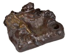 Joseph Bernard (French, 1866-1931), a bronze figural inkwell, of lovers in the waves, dark brown