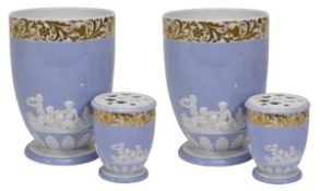 A pair of Spode lilac-ground pot-pourri urns, sprigged in white with putti above a basal stiff-leaf