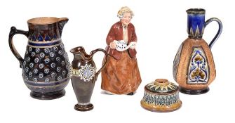 A group of seven Doulton pieces, comprising: an unusual Lambeth stoneware panelled tapering jug by