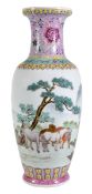 A Chinese famille rose vase of slender ovoid form decorated in a typical palette of enamels with