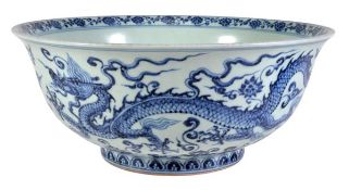 A Chinese blue and white bowl, of flared circular form decorated with five-clawed dragons amid