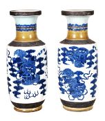 A pair of large Chinese blue and white rouleau vases, each of regular form and decorated in moulded