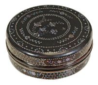 A Chinese lac burgaute box of circular form decorated with flowering shrubs within concentric