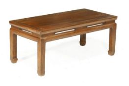 A Chinese wood kang table, with square, moulded legs, scroll feet, 44cm high, 103cm wide, 51cm