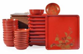 An attractive suite of Japanese lacquer wares comprising ten trays each of rounded square form