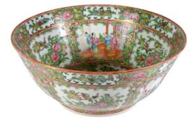 A large Cantonese punch bowl of deep circular form decorated in a typical palette of overglaze
