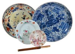 A Chinese famille rose Mandarin pattern plate painted with figures in a garden setting within a
