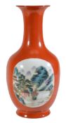 A Chinese famille rose coral ground vase of ovoid form with flared foot and cylindrical neck rising