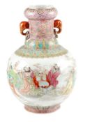 A large Chinese famille rose porcelain vase painted with a continuous scene featuring luohans and