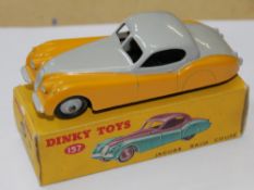 A Dinky No.157, Jaguar XK120 Coupe, pale grey over yellow, pale grey ridged hubs, near mint,