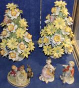 Three Continental figurines of young boys and girls and two Italian ceramic models of floral still