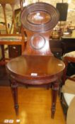 A Regency mahogany hall chair.