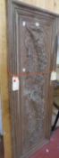 A carved oak panel decorated with floral swags 158cm x 57cm