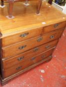 A George III walnut chest of two short and three long drawers