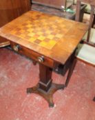 A Victorian rosewood games table inlaid for chess, fitted a drawer on tapered column with inswept