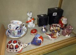 A group of eight Royal Crown Derby paper weights, including a frog, duck, Father Christmas, robin,