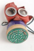 A Second World War British Home Front `Mickey Mouse` Childs Respirator, of standard production