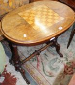 A Victorian figured walnut chess top table