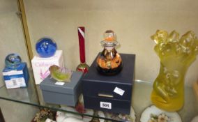 Two boxed Caithness glass paperweights, a similar boxed inkwell, a Daum vase decorated with a female