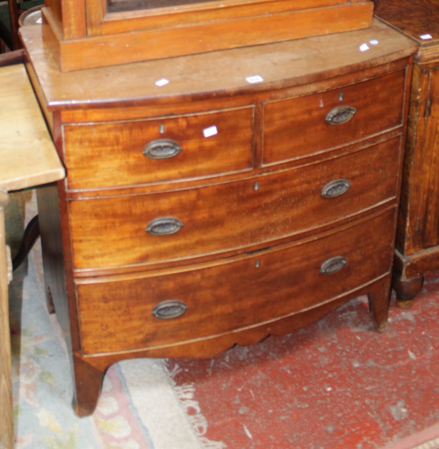 A Regency mahogany bowfront chest of two short and two long drawers, 91.5cm in length