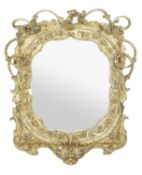 A Victorian gilt composition framed wall mirror, circa 1870, of cartouche form outlined with