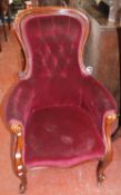 A Victorian mahogany show frame easy chair on cabriole legs