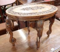 An Indian carved hardwood elephant coffee table 38cm high, 51cm length