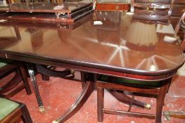 A Regency style triple mahogany pedestal dining table with three additional leaves 260cm length