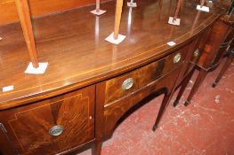 A George III style mahogany bowfront sideboard with an ornate two tier table