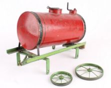 A tinplate street water carrier, possibly by Bing, the underside of the frame printed `Made in