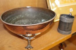 An Arts and Crafts copper bowl with rope twist border and on cast brass legs, 23cm diameter and a