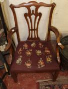 A George III style mahogany armchair with drop in needlework seat